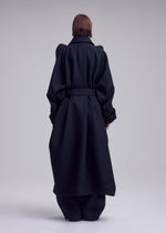 A model wears the ISSEY MIYAKE CALLIGRAPH calligraph-coat-purple.