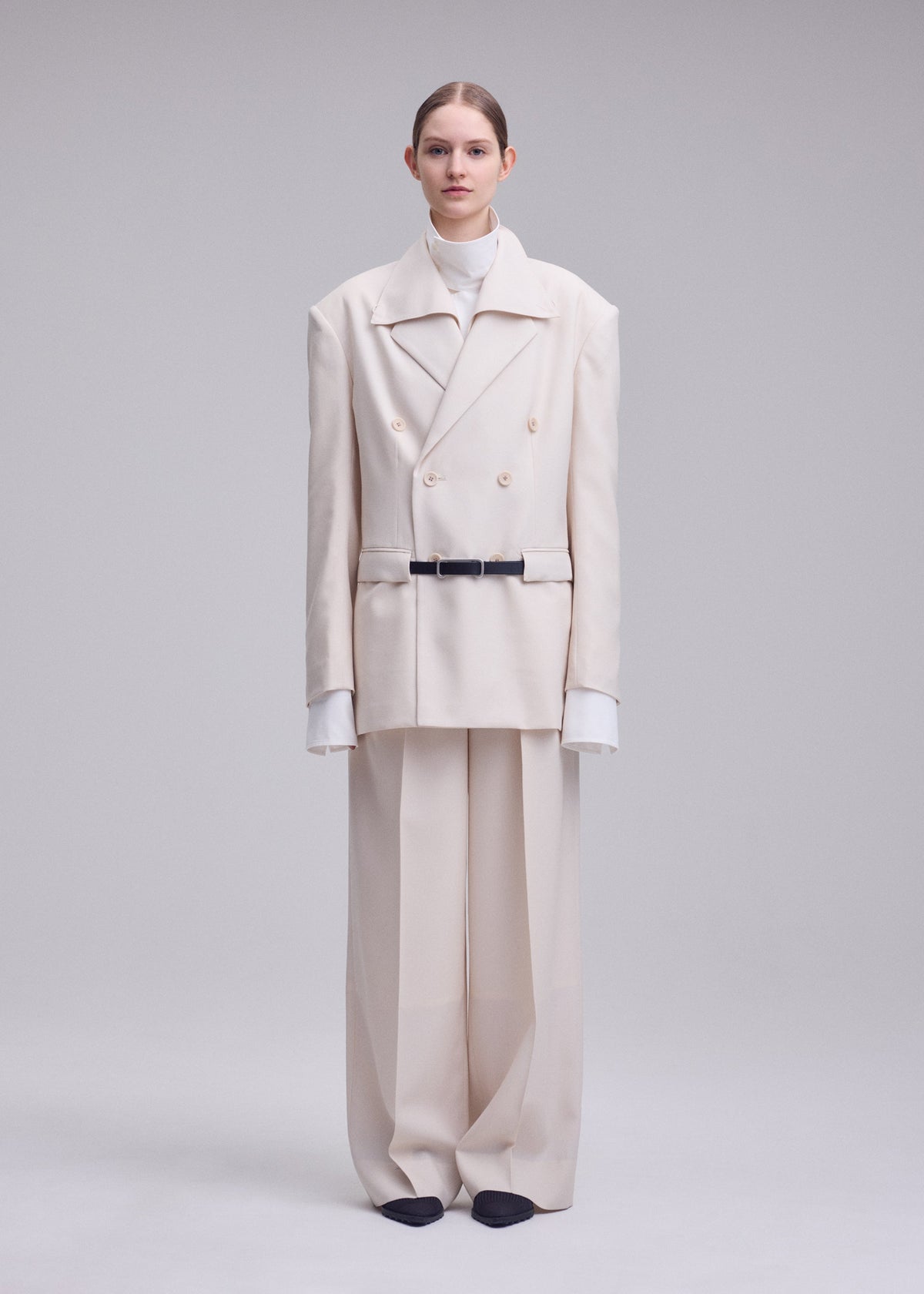 A model wears the ISSEY MIYAKE UNTITLED untitled-jacket-brown.