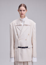 A model wears the ISSEY MIYAKE UNTITLED untitled-jacket-brown.
