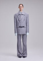A model wears the ISSEY MIYAKE HONEST ENSEMBLE honest-ensemble-jacket-black.