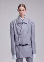 A model wears the ISSEY MIYAKE HONEST ENSEMBLE honest-ensemble-jacket-black.