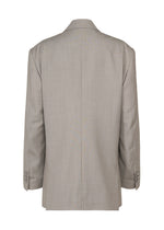 A detail shot of the ISSEY MIYAKE HONEST ENSEMBLE jacket.