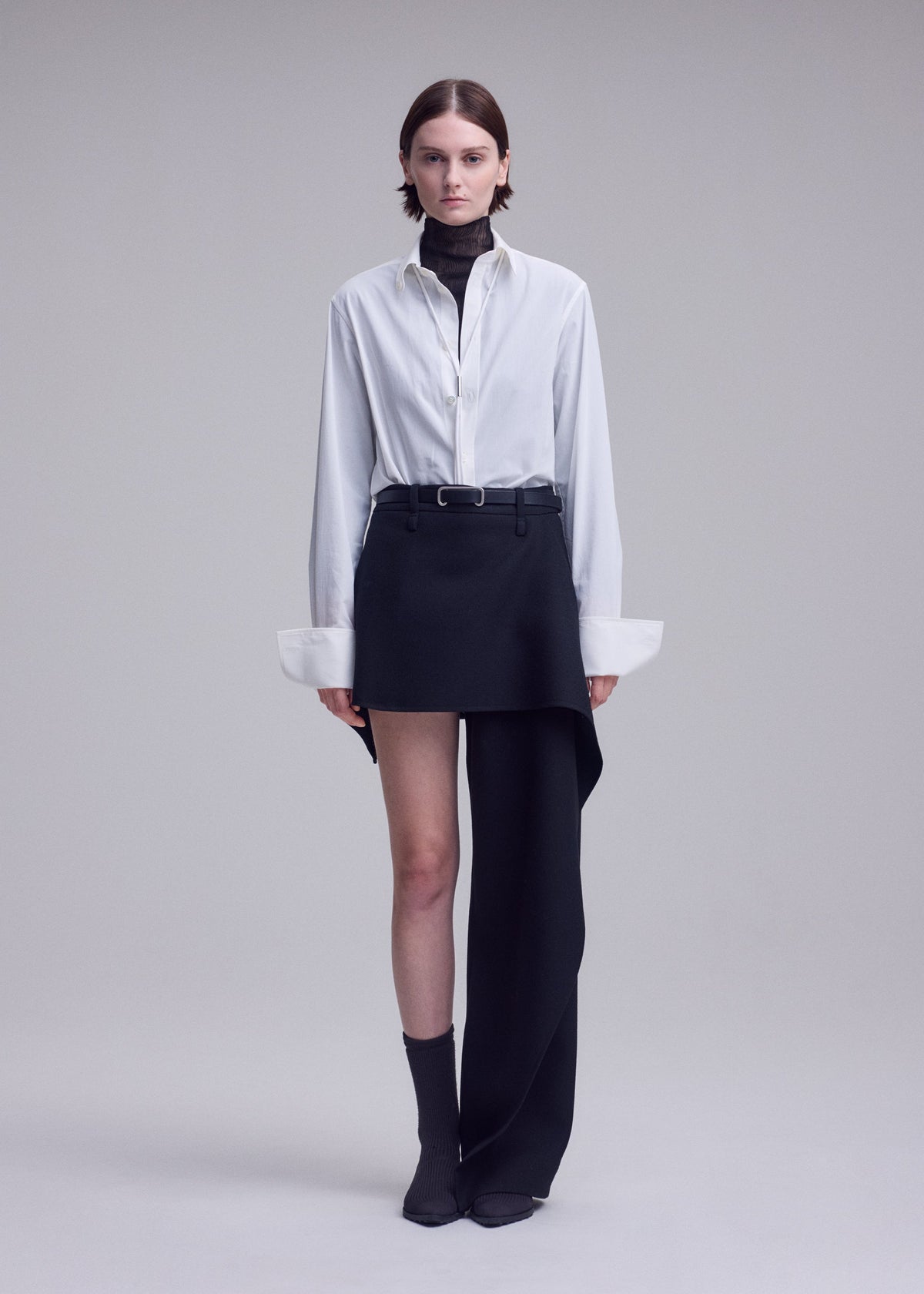 A model wears the ISSEY MIYAKE CALLIGRAPH calligraph-trousers-purple-1.