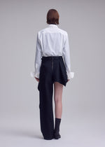 A model wears the ISSEY MIYAKE CALLIGRAPH calligraph-trousers-purple-1.