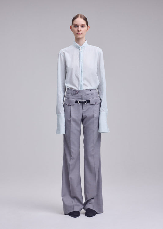 A model wears the ISSEY MIYAKE HONEST ENSEMBLE honest-ensemble-trousers-grey.