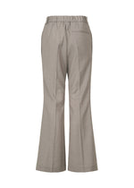 A detail shot of the ISSEY MIYAKE HONEST ENSEMBLE trousers.