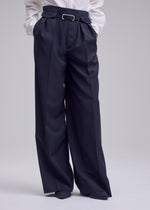 A model wears the ISSEY MIYAKE HONEST ENSEMBLE honest-ensemble-wide-leg-trousers-black.