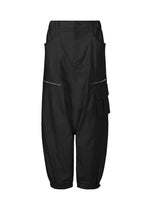 A product shot of the ISSEY MIYAKE GRAINY PANTS trousers in black.