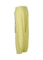 A detail shot of the ISSEY MIYAKE GRAINY PANTS trousers.
