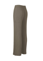 A detail shot of the ISSEY MIYAKE HATCHING PLEATS trousers.