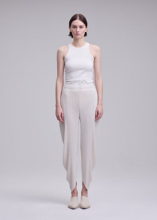 A model wears the ISSEY MIYAKE LEAF PLEATS leaf-pleats-trousers-light-blue.