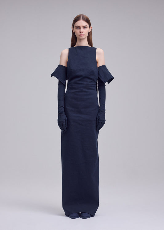 A model wears the ISSEY MIYAKE ALLOW dress.