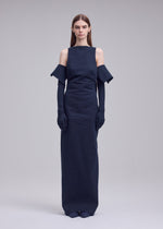 A model wears the ISSEY MIYAKE ALLOW dress.