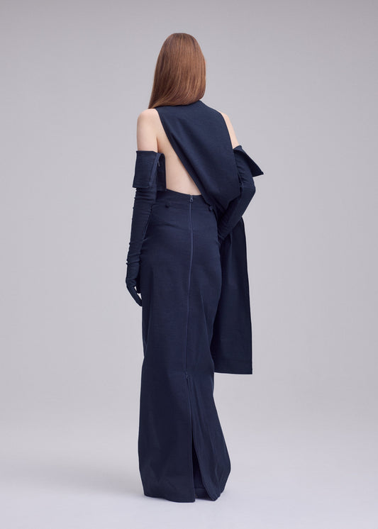A model wears the ISSEY MIYAKE ALLOW allow-dress-off-white.