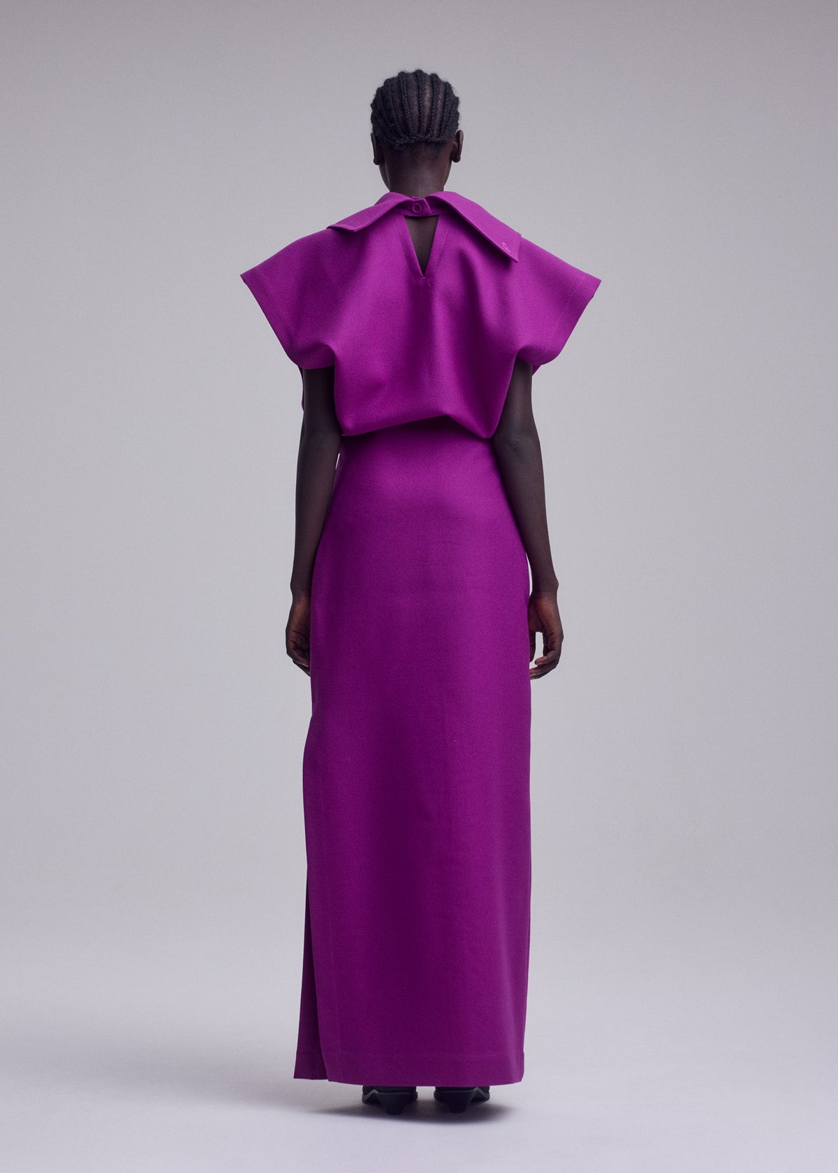 A model wears the ISSEY MIYAKE CALLIGRAPH calligraph-dress-black.