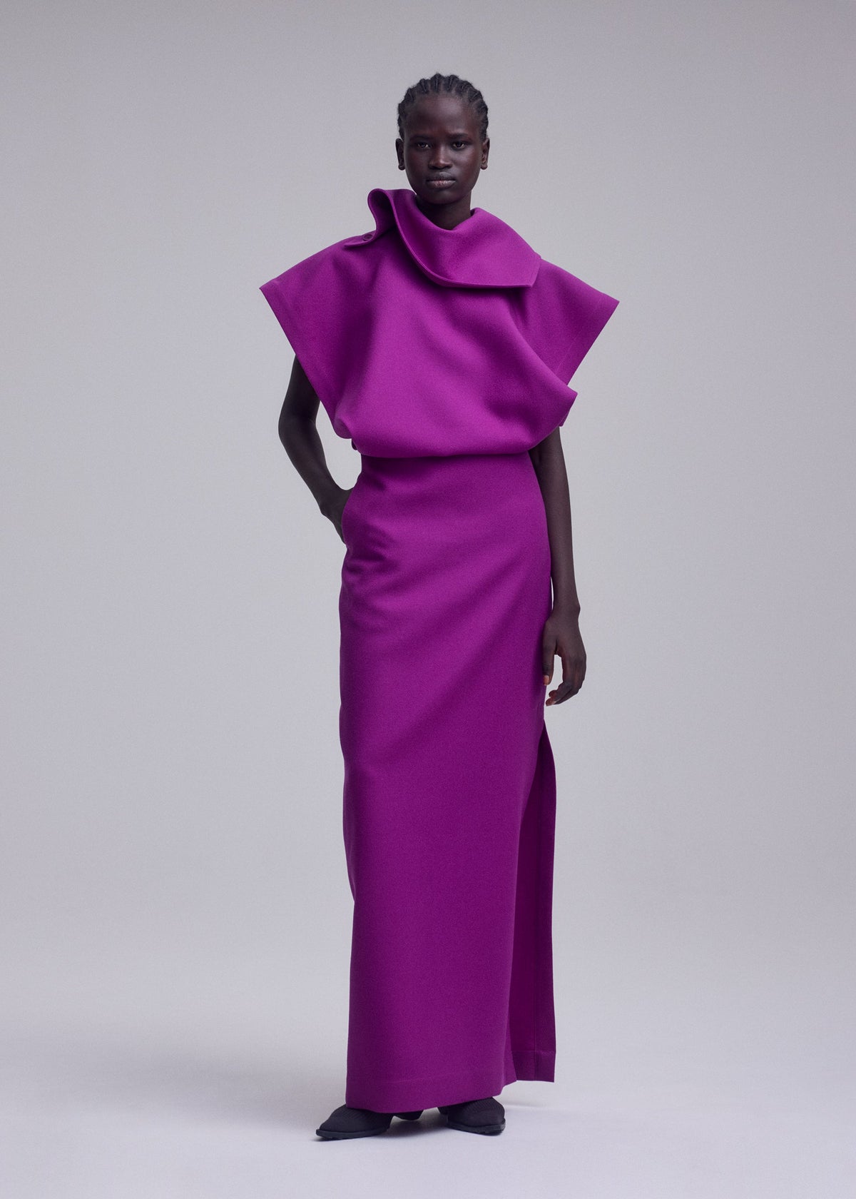 A model wears the ISSEY MIYAKE CALLIGRAPH calligraph-dress-black.
