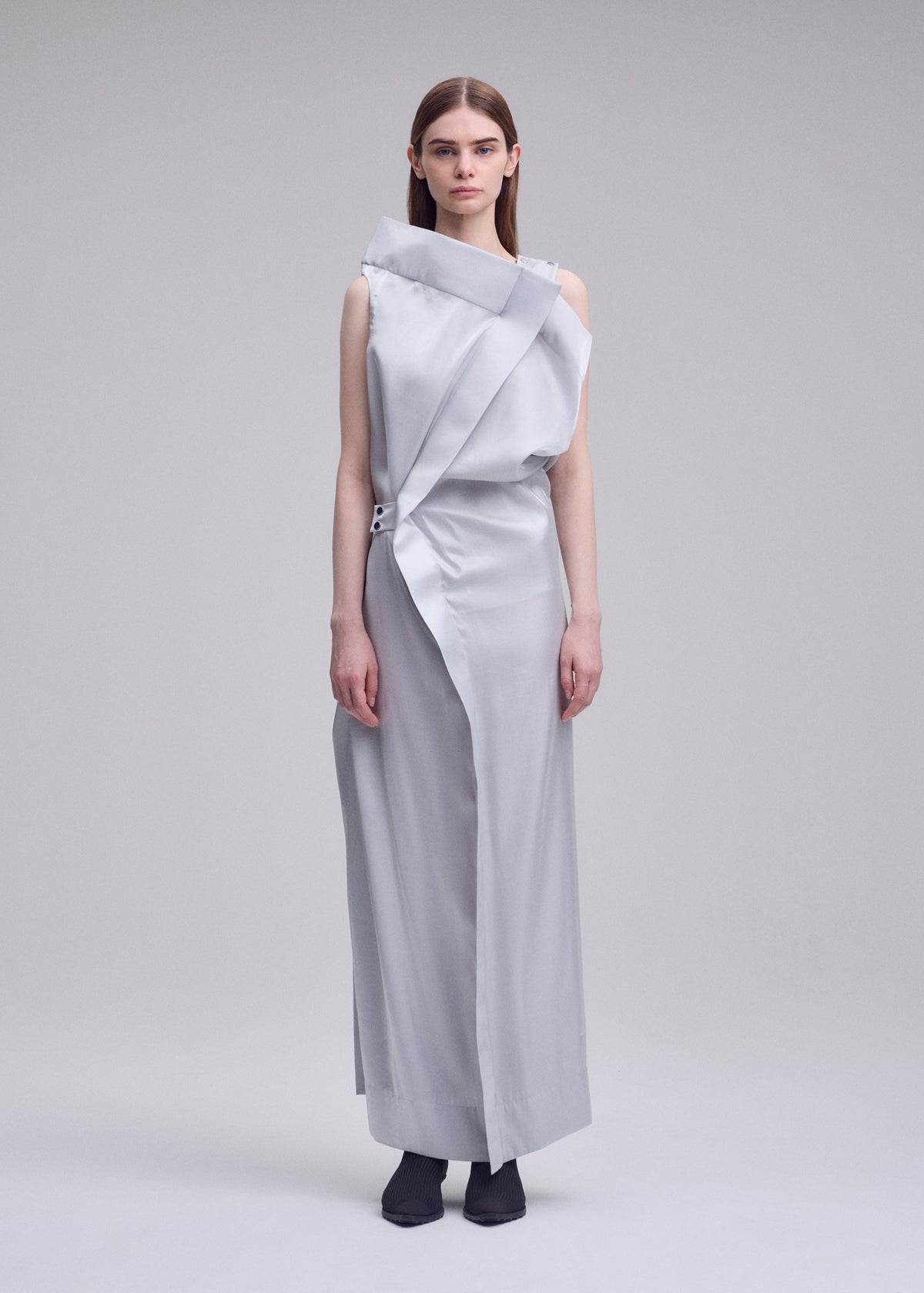A model wears the ISSEY MIYAKE MERCURY dress.
