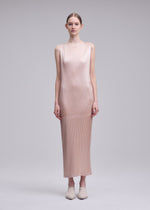 A model wears the ISSEY MIYAKE GLOSSED PANELS PLEATS glossed-panels-pleats-dress-black.