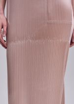 A model wears the ISSEY MIYAKE GLOSSED PANELS PLEATS glossed-panels-pleats-dress-grey.