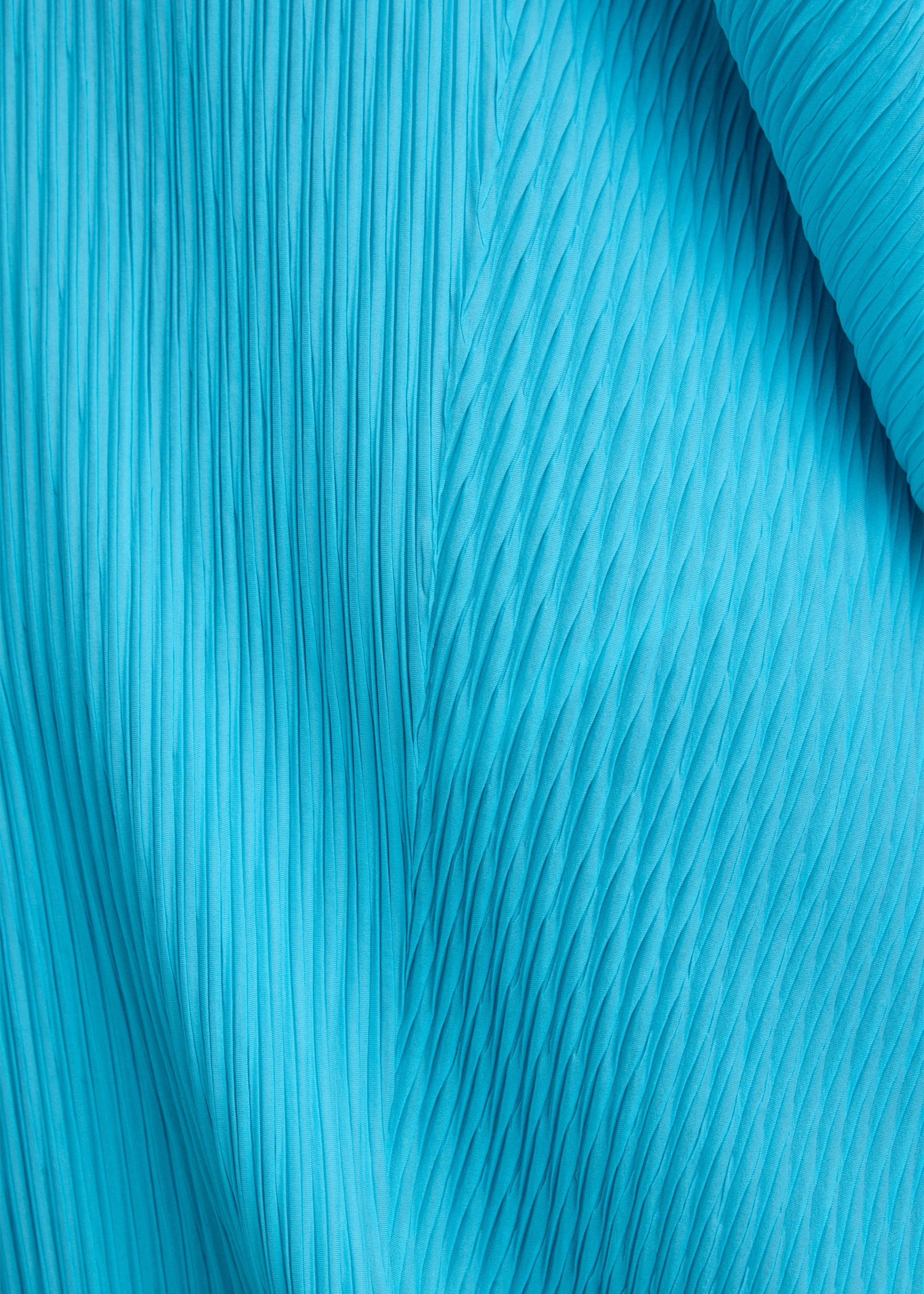 A model wears the ISSEY MIYAKE LEAF PLEATS leaf-pleats-dress-off-white.