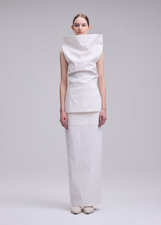 A model wears the ISSEY MIYAKE ALLOW top.
