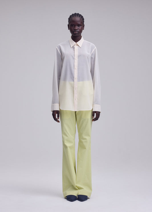 A model wears the ISSEY MIYAKE SHEER WOOL shirt.