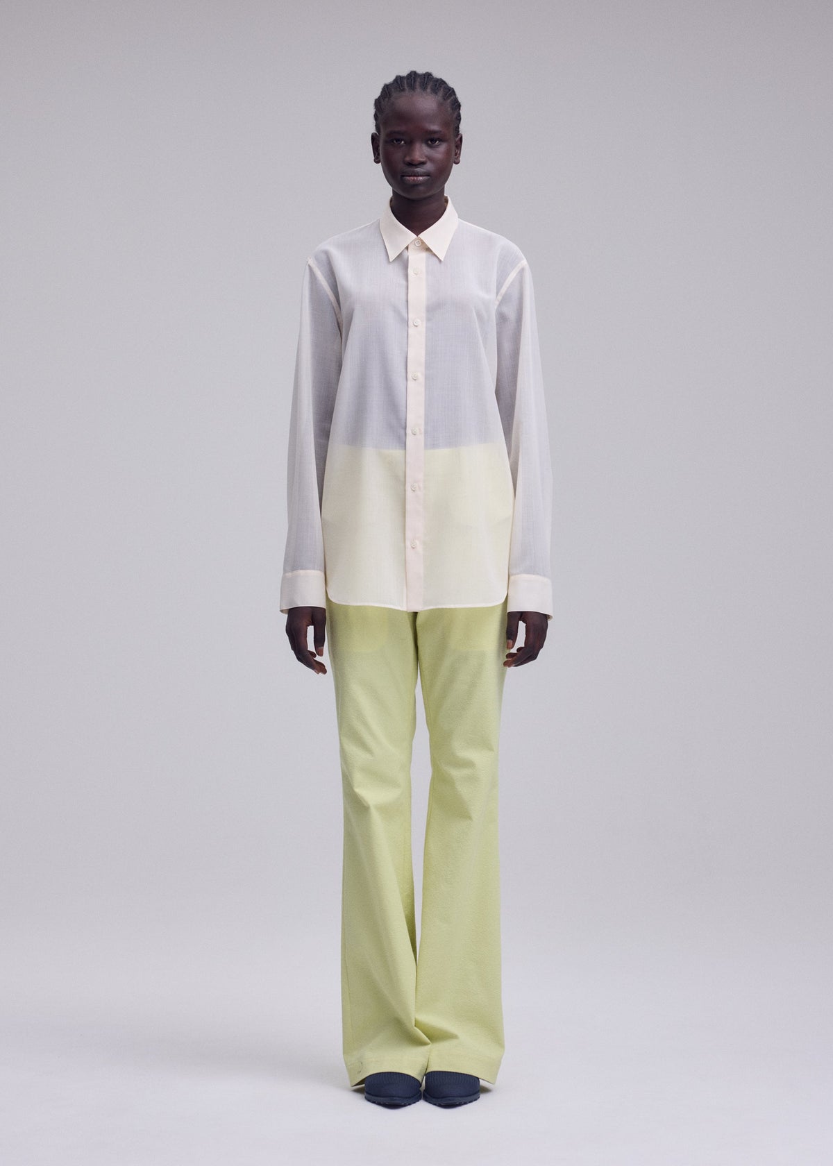 A model wears the ISSEY MIYAKE SHEER WOOL shirt.