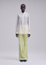 A model wears the ISSEY MIYAKE SHEER WOOL shirt.