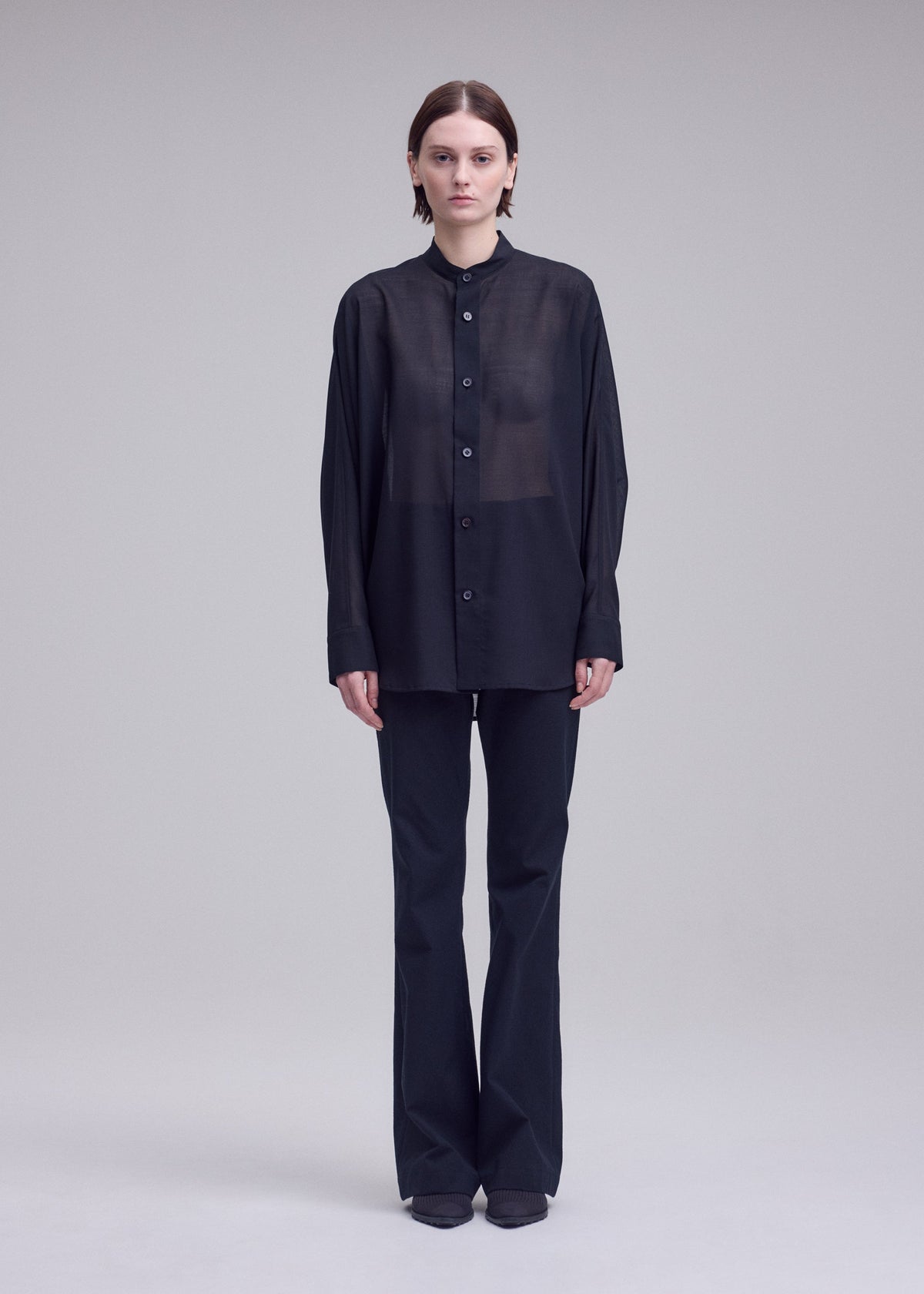A model wears the ISSEY MIYAKE SHEER WOOL shirt.