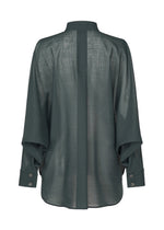 A detail shot of the ISSEY MIYAKE SHEER WOOL shirt.