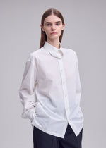 A model wears the ISSEY MIYAKE MONSIEUR SHIRT monsieur-shirt-shirt-black.