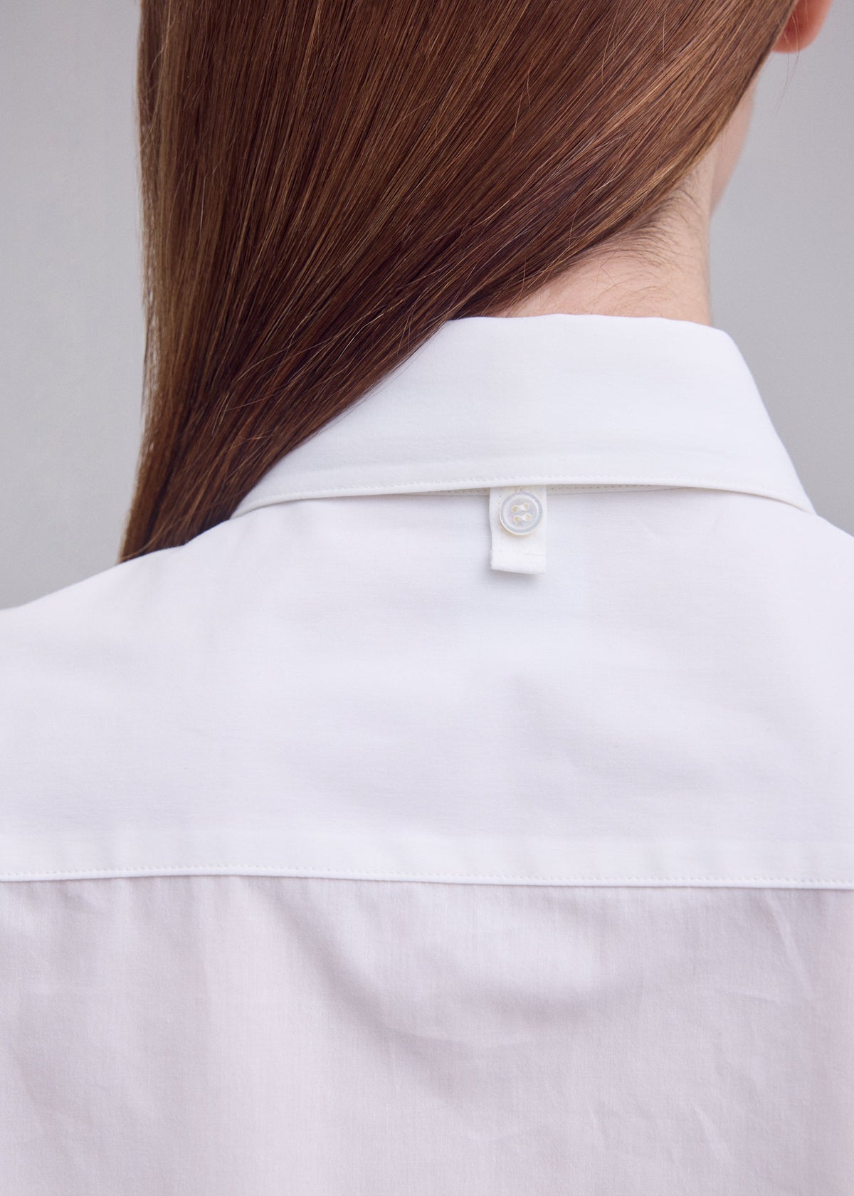 A model wears the ISSEY MIYAKE MONSIEUR SHIRT monsieur-shirt-shirt-white.