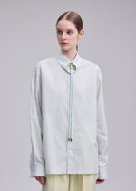A model wears the ISSEY MIYAKE MONSIEUR SHIRT(DOBBY STRIPE) monsieur-shirt-dobby-stripe-shirt-black-hued.