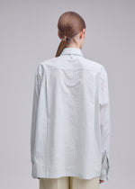 A model wears the ISSEY MIYAKE MONSIEUR SHIRT(DOBBY STRIPE) monsieur-shirt-dobby-stripe-shirt-black-hued.