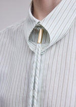 A model wears the ISSEY MIYAKE MONSIEUR SHIRT(DOBBY STRIPE) monsieur-shirt-dobby-stripe-shirt-white-hued.