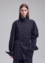 A model wears the ISSEY MIYAKE MONSIEUR SHIRT(DOBBY STRIPE) monsieur-shirt-dobby-stripe-bolo-tie-belt-shirt-white-hued.