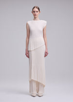 A model wears the ISSEY MIYAKE UNFURLING PLEATS top.