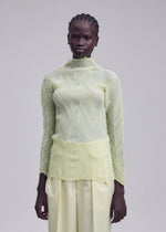 A model wears the ISSEY MIYAKE ZIGZAG PLEATS zigzag-pleats-long-sleeved-top-light-blue.