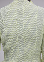 A model wears the ISSEY MIYAKE ZIGZAG PLEATS zigzag-pleats-long-sleeved-top-light-blue.