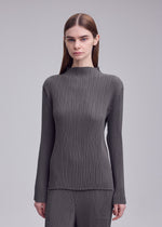 A model wears the ISSEY MIYAKE HATCHING PLEATS hatching-pleats-mock-neckline-top-black.