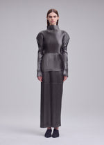 A model wears the ISSEY MIYAKE GLOSSED PANELS PLEATS glossed-panels-pleats-top-black.