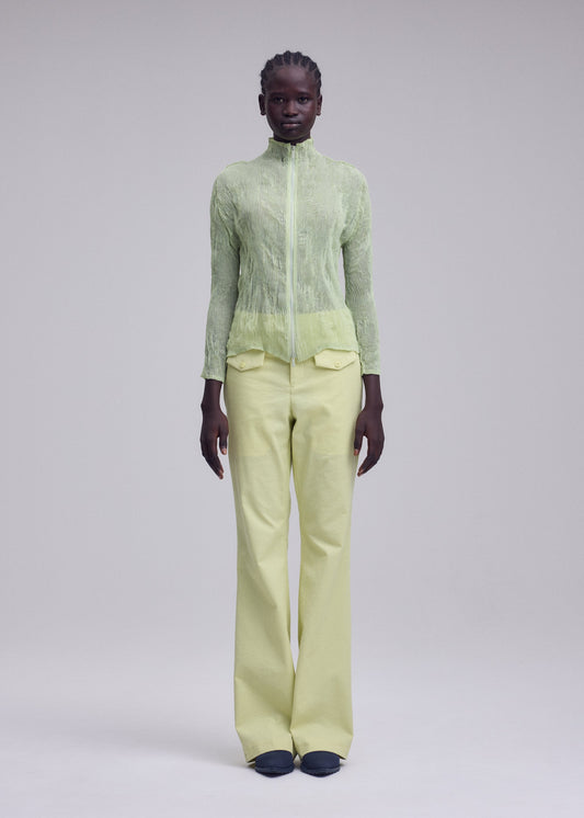 A model wears the ISSEY MIYAKE CHIFFON TWIST 1 cardigan.