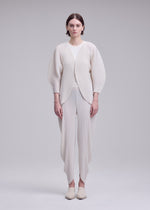 A model wears the ISSEY MIYAKE LEAF PLEATS leaf-pleats-cardigan-dark-navy.