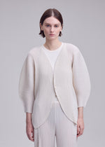 A model wears the ISSEY MIYAKE LEAF PLEATS leaf-pleats-cardigan-dark-navy.