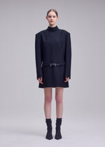 A model wears the ISSEY MIYAKE UNTITLED untitled-tunic-brown.