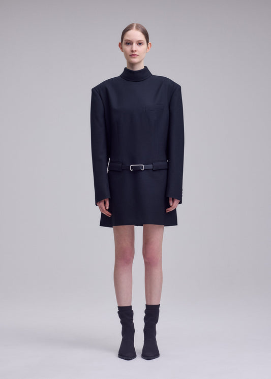 A model wears the ISSEY MIYAKE UNTITLED untitled-tunic-brown.