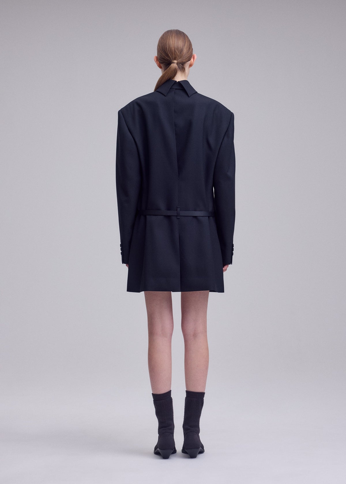 A model wears the ISSEY MIYAKE UNTITLED untitled-tunic-brown.