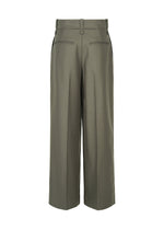 A detail shot of the ISSEY MIYAKE SHELL trousers.