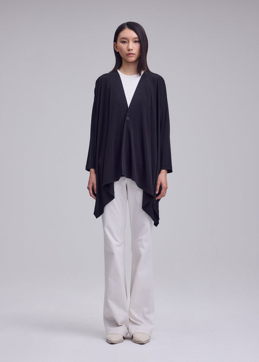 A model wears the ISSEY MIYAKE DRAPE JERSEY-68 cardigan.