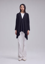 A model wears the ISSEY MIYAKE DRAPE JERSEY-68 cardigan.